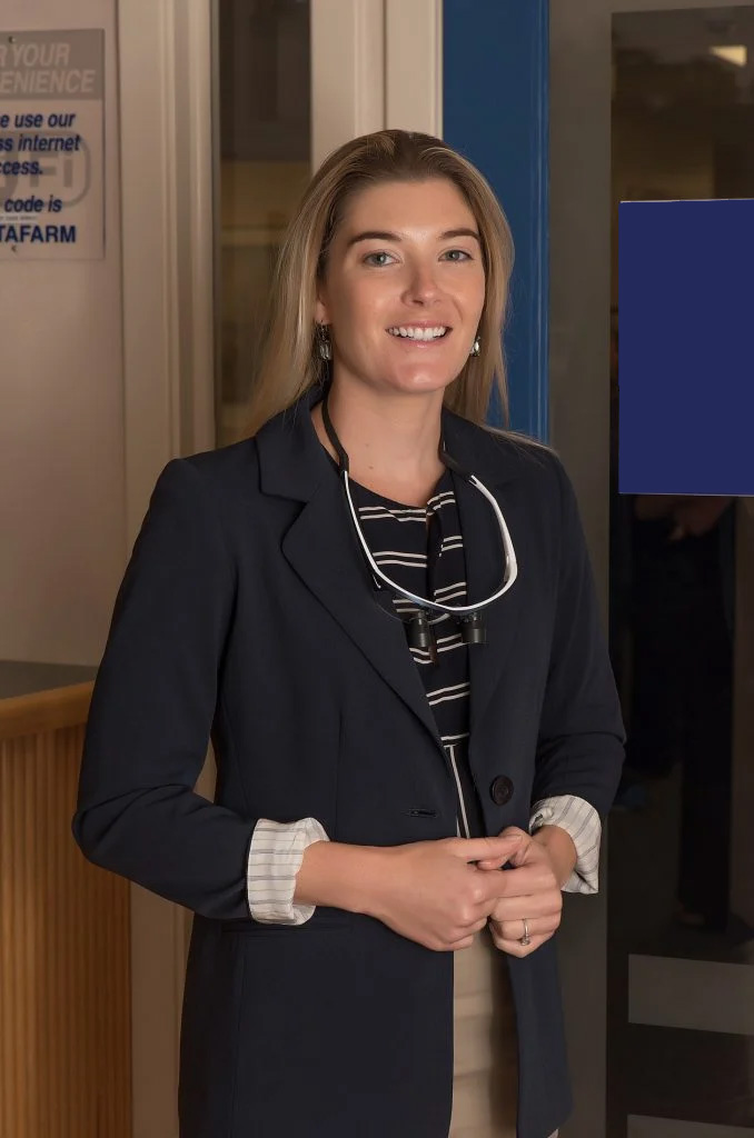 Dr. Carolyn Dominica Smiling in an Office
