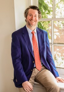 Photo of Dr. Alexander Cauterucci inf front of a window